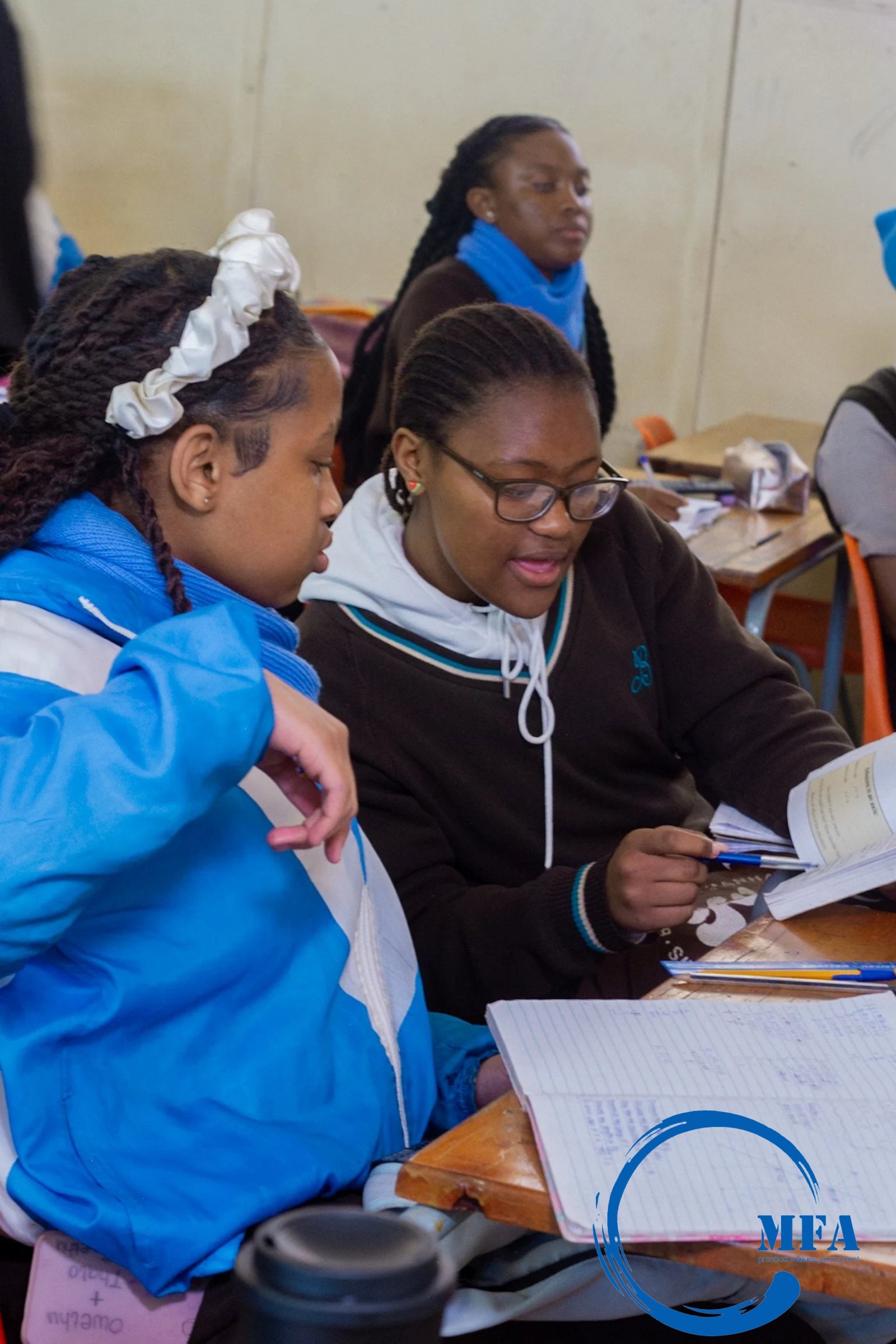 Two students collaborating on classwork